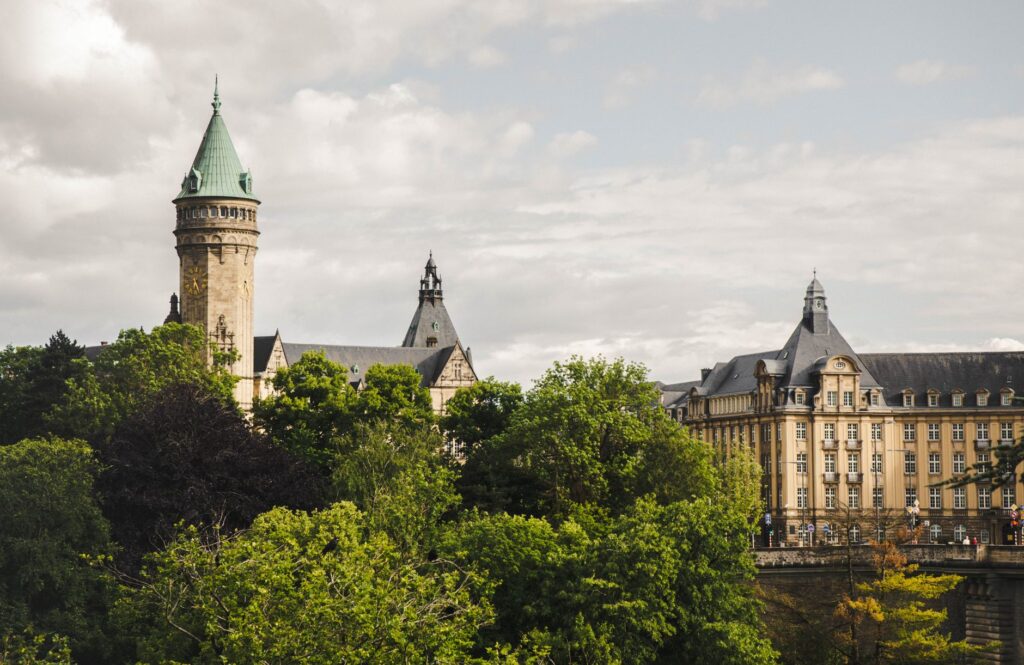 Historic architecture set against lush greenery in Luxembourg City.
