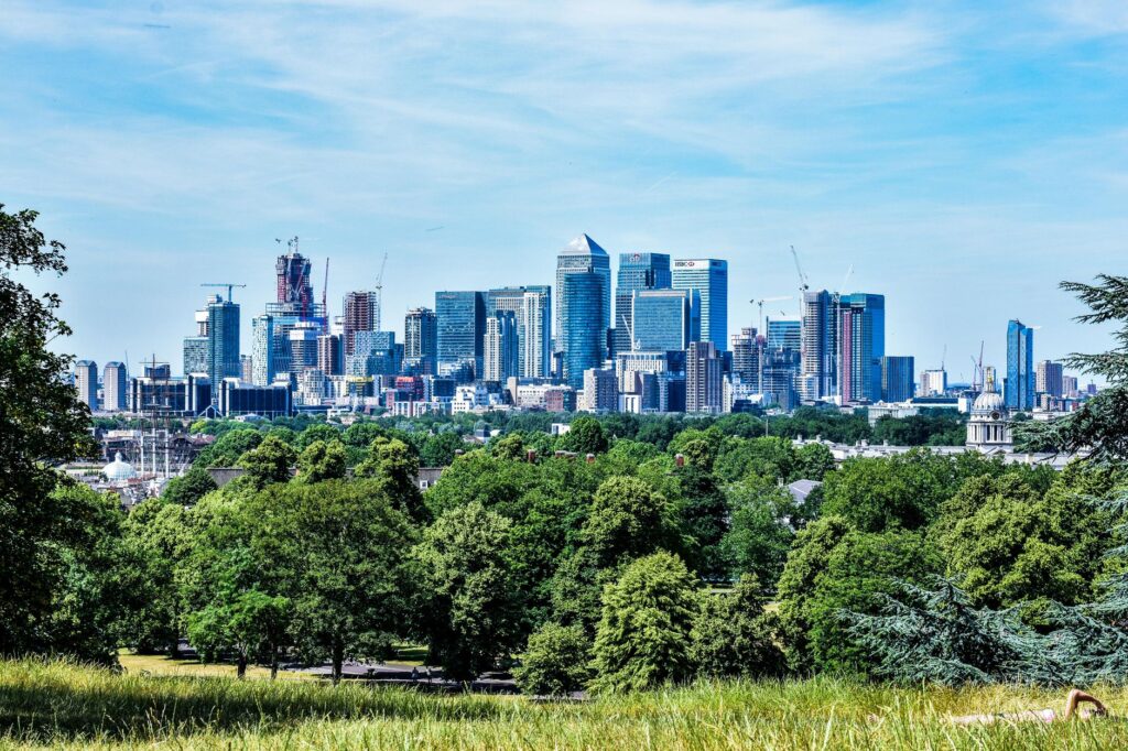 Stunning view of London skyline with greenery from Greenwich Park.